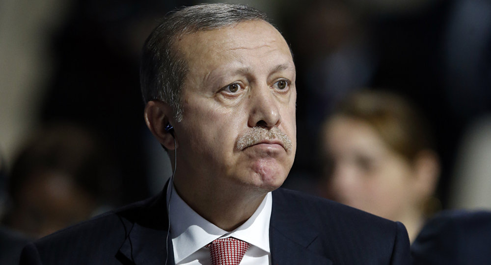 Turkey's President Recep Tayyip Erdogan listens to statements at the COP21, United Nations Climate Change Conference, in Le Bourget, outside Paris, Monday, Nov. 30, 2015