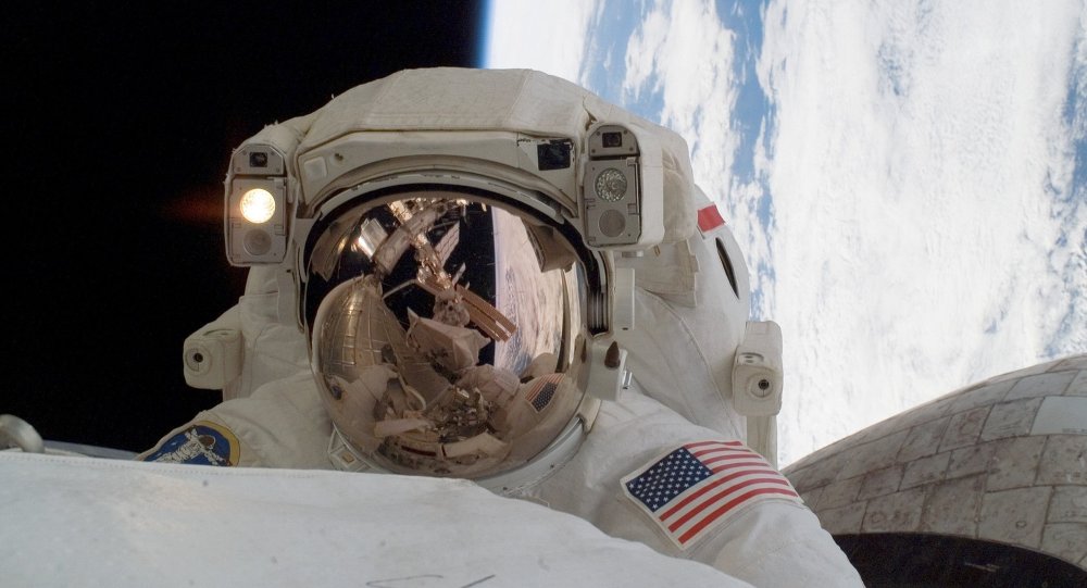 Astronaut Rick Linnehan, STS-123 mission specialist, participates in the mission's first scheduled session of extravehicular activity (EVA) as construction and maintenance continue on the International Space Station. 