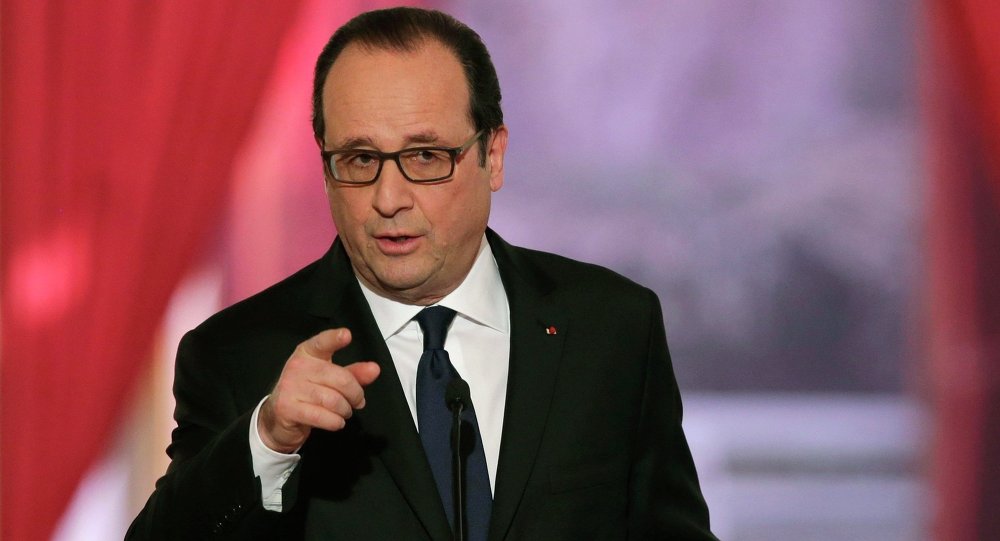 French President Francois Hollande gestures as he answers a question during a news conference at the Elysee Palace in Paris February 5, 2015