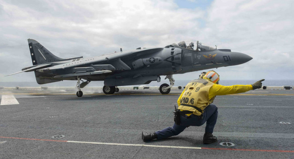 An AV-8B Harrier, assigned to the Marine Attack Squadron 231(VMA), takes off from the flight deck of forward-deployed amphibious assault ship USS Bonhomme Richard.