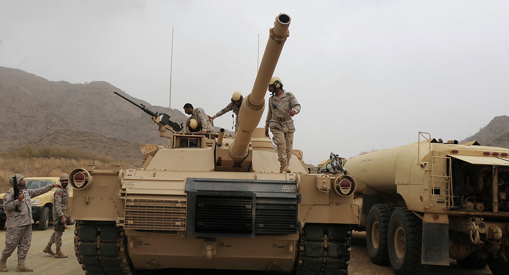 Saudi soldiers are seen on top of their tank deployed at the Saudi-Yemeni border, in Saudi Arabia's southwestern Jizan province