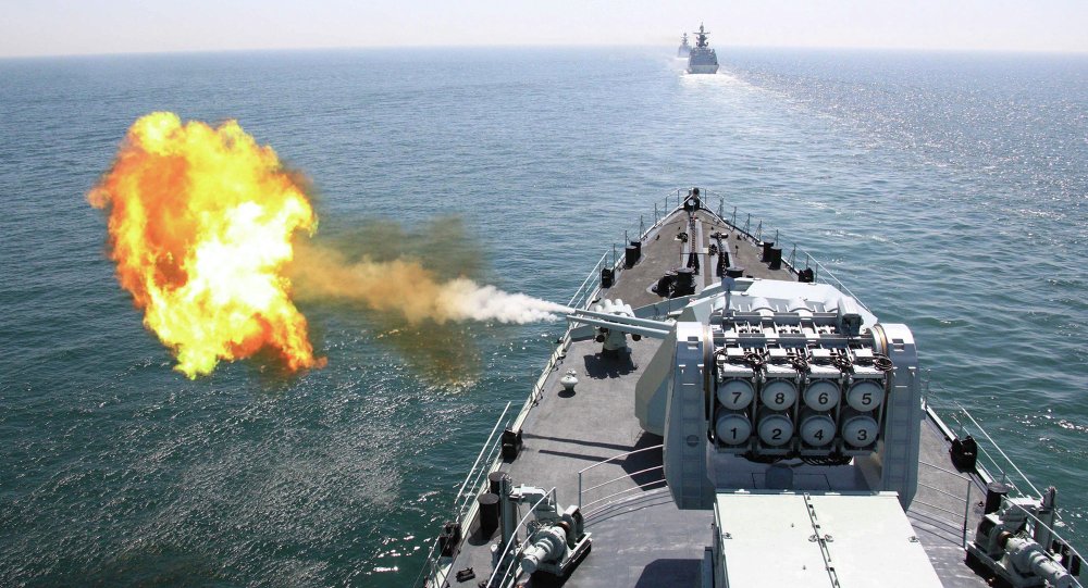 In this April 26, 2012 file photo released by China's Xinhua News Agency, Chinese navy's missile destroyer DDG-112 Harbin fires a shell during the China-Russia joint naval exercise in the Yellow Sea