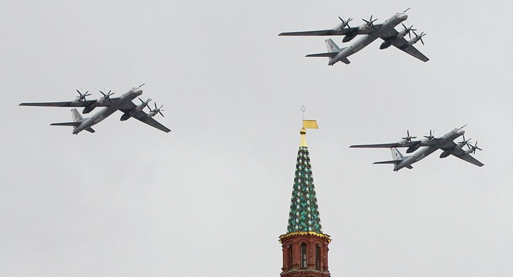 Russian Air Force strategic bombers, Tu-95, fly in formation over Red Square.