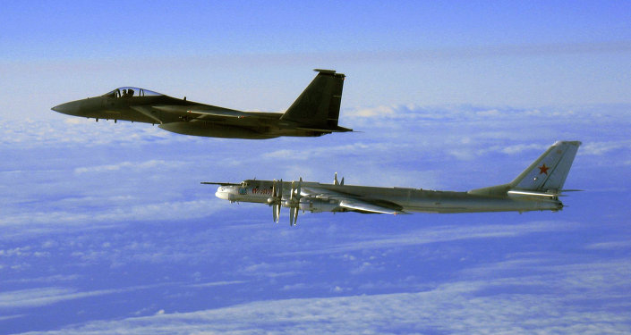 This Thursday, Sept. 28, 2006 file photo provided by the U.S. Air Force shows an F-15C Eagle from the 12th Fighter Squadron at Elmendorf Air Force Base in Anchorage, Alaska, flying next to a Russian Tu-95 Bear bomber, right, during a Russian exercise which brought the bomber near the west coast of Alaska