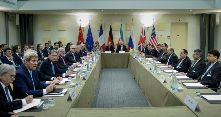 Officials wait for a meeting with officials from P5+1, the European Union and Iran at the Beau Rivage Palace Hotel March 31, 2015 in Lausanne.