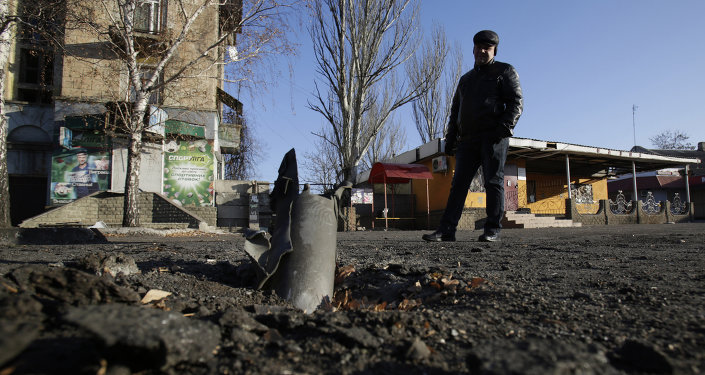 A man looks at Grad rocket louncher system after shelling ofmilita on November 23, 2014 in eastern Ukrainian city of Debalcevo