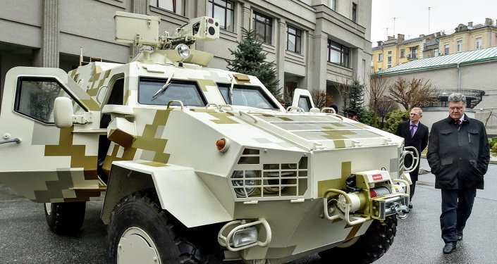 Ukraine's President Petro Poroshenko inspects an armoured vehicle in Kiev