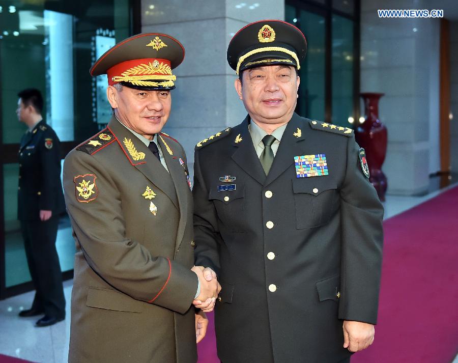 Chinese Defence Minister Chang Wanquan (R) meets with Russian Defence Minister Sergei Shoigu in Beijing, capital of China, Nov. 18, 2014. (Xinhua/Li Tao)